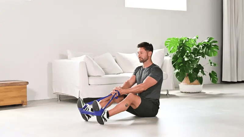Übung Sitting Twist mit dem ARTZT vitality Fitnessband