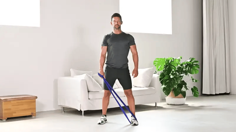 Übung Standing Side Abs mit dem ARTZT vitality Fitnessband